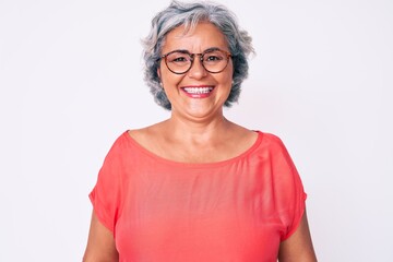 Senior hispanic grey- haired woman wearing casual clothes and glasses with a happy and cool smile on face. lucky person.