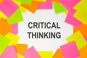 Text critical thinking on a white background. Multicolored stickers around