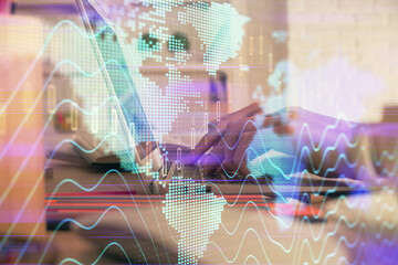 Double exposure of woman hands typing on computer and forex chart hologram drawing. Stock market invest concept.