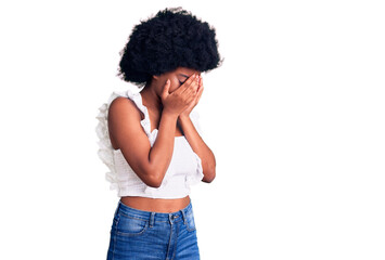 Young african american woman wearing casual clothes with sad expression covering face with hands while crying. depression concept.