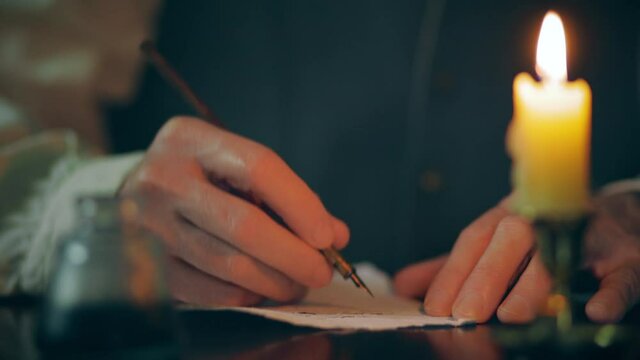 macro 18th century man writing a letter