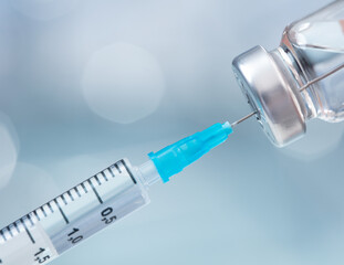 close-up view of syringe and pills 