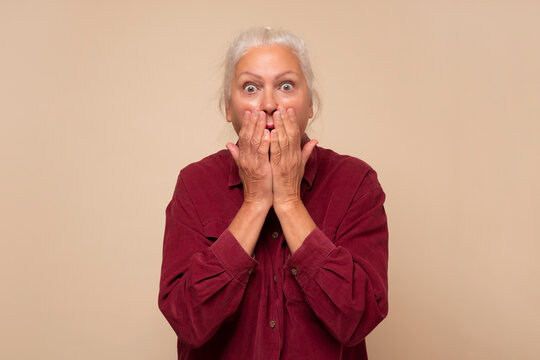 Senior Woman Being Embarrassed, Giggling Covering Mouth With Hands