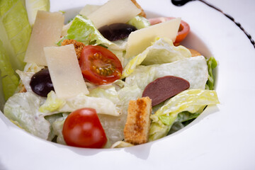 caesar salad in a white bowl