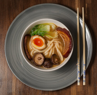 Japanese ramen soup with pork (chasu), marinated egg, pak choi, shiitake, smoked tofu and noodles