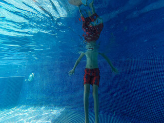 Fototapeta na wymiar Beautiful view of a teenager inside a pool