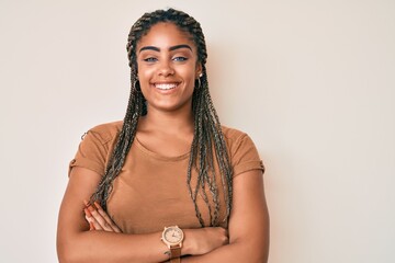 Young african american woman with braids wearing casual clothes happy face smiling with crossed...