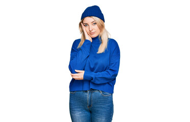 Young caucasian woman wearing wool winter sweater and cap thinking looking tired and bored with depression problems with crossed arms.