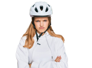 Beautiful young caucasian girl wearing bike helmet skeptic and nervous, disapproving expression on face with crossed arms. negative person.