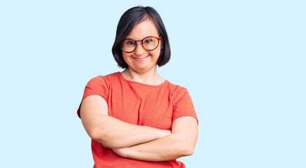 Brunette woman with down syndrome wearing casual clothes and glasses happy face smiling with...