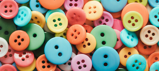 Fototapeta na wymiar Multi-colored Plastic Buttons. Long Banner
