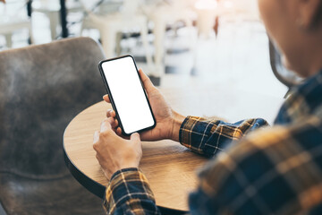 cell phone blank white screen mockup.woman hand holding texting using mobile on desk at office.background empty space for advertise.work people contact marketing business,technology