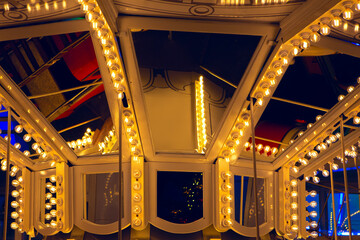 Carousel illumination lamps . Inside amusement park