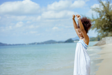 Fototapeta na wymiar Kid girl american african playing relax enjoy life funny moment on the beach