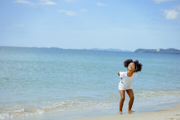 Kid girl american african playing relax enjoy life funny moment on the beach