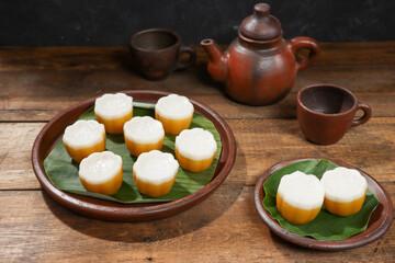 Kue Talam is an Indonesian traditional snack, made from sweet potatoes and thick coconut milk. Selective focus.
