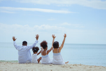 Ethnicity Happy Family Africans Enjoy relaxation resting on the beach summer