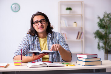 Young male student preparing for exams