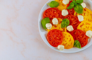 Vegetarian salad made from tomato, mozzarella and basil.