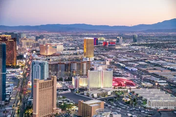Gordijnen LAS VEGAS, NV - JUNE 29, 2018: Sunset aerial view of Casinos and Hotels along The Strip. This is the famous city road full of Casinos and Hotels © jovannig