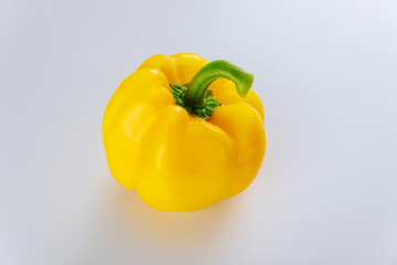 Fresh ripe yellow bell pepper isolated on white.