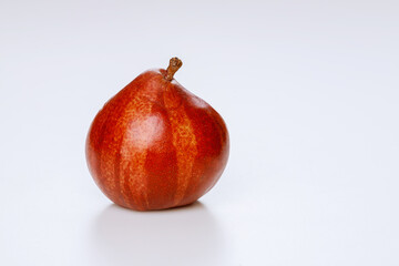 Red pear isolated on white background.