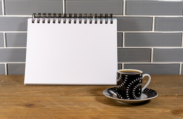 Blank spiral notepad in a modern kitchen with espresso