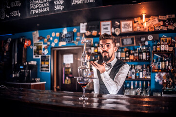 Barman formulates a cocktail in the brasserie