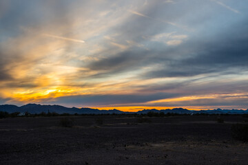 Fototapeta na wymiar Dramatic vibrant sunset scenery in Parker Dam Road, Arizona