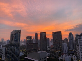 Red sky with wide view cityscape on rooftop bar