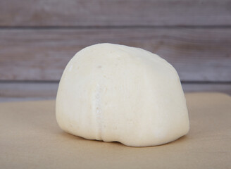 A white flour bun on the table