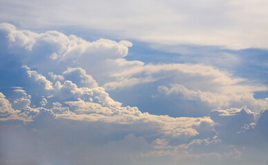 Beautiful blue sky with white fluffy cloud background