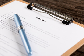 Business people signing a contract