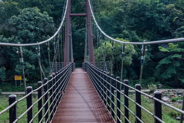 Suspension bridge over mountain valley