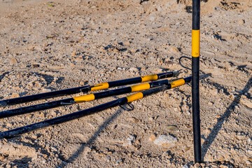 Metal black and yellow marker poles