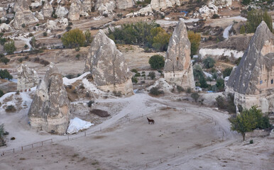 Fototapeta na wymiar Ancient cave houses and rock formations near Goreme, Cappadocia, Turkey
