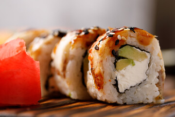 Still life with appetizing rolls. Japanese food concept. Close-up.