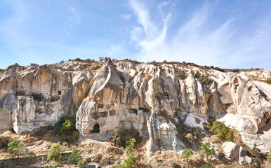 Fototapeta premium Ancient cave houses and rock formations near Goreme, Cappadocia, Turkey