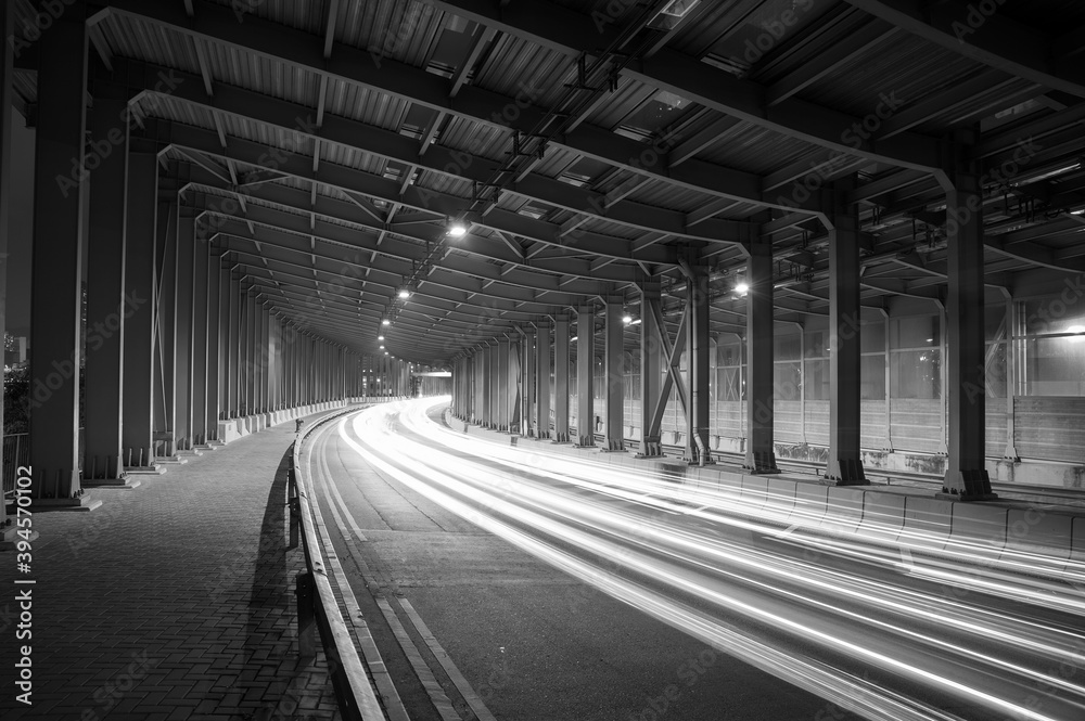 Poster light trails and head lights of traffic in tunnel