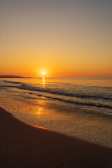 Fototapeta na wymiar A peaceful sunrise on a beach on the Costa Azahar