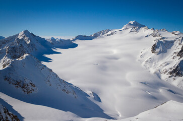 Mountains covered with snow in Solden ski area on beautiful sunny winter day, Tirol, Austria
