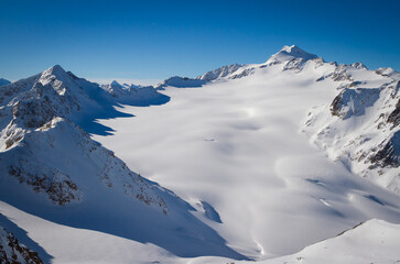 Naklejka premium Mountains covered with snow in Solden ski area on beautiful sunny winter day, Tirol, Austria