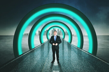 Confident businessman standing in futuristic tunnel