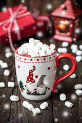 Cup of creamy hot chocolate with melted marshmallows