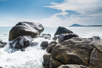 Seascape of waves splashing the stones in the rocky coastline of Yangxi, Yangjiang of China