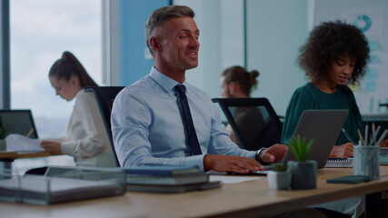 Obraz premium Businessman waving hand on laptop camera. Worker having video call on laptop