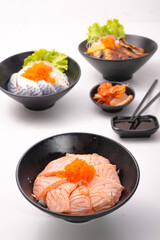 salmon donburi - japanese sliced salmon on rice bowl