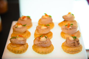 scallop canepe on white tray