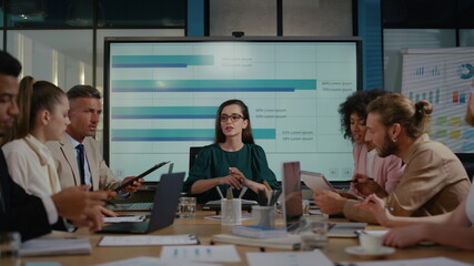 Female executive making presentation of new financial strategy in company