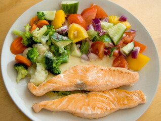 Grilled salmon and vegetables on a plate